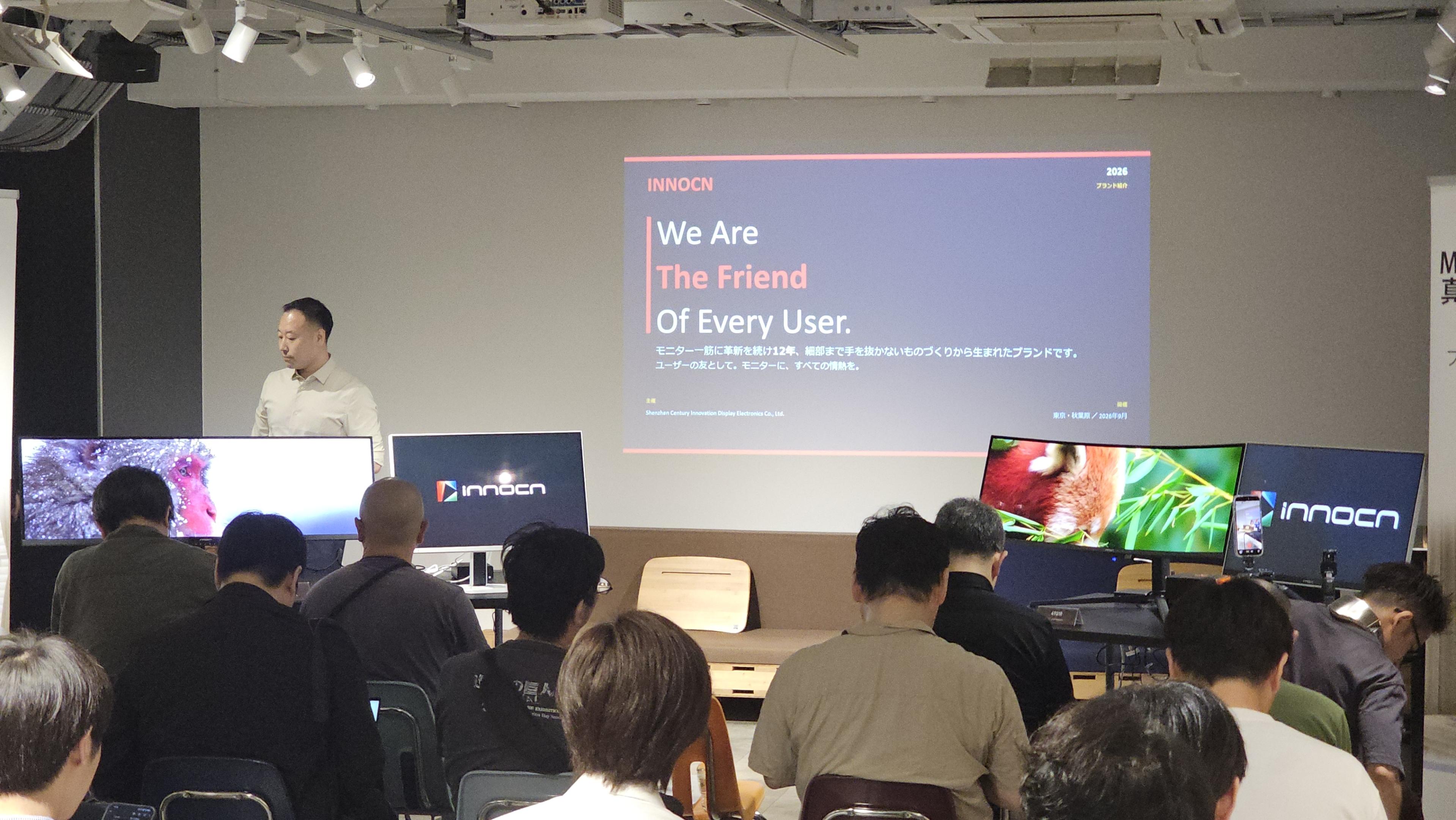 INNOCN’s Tokyo product presentation, showing the speaker, attendees and demonstration monitors with the original company branding.