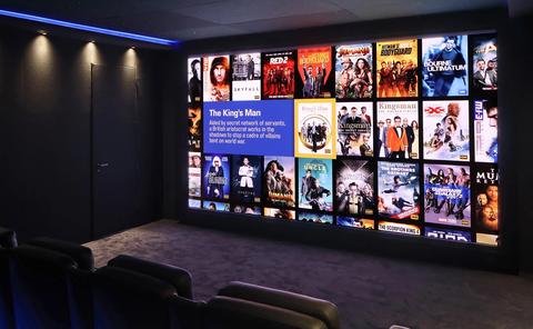 Residential cinema LED wall displaying a movie library, as illustrated in Barco’s announcement