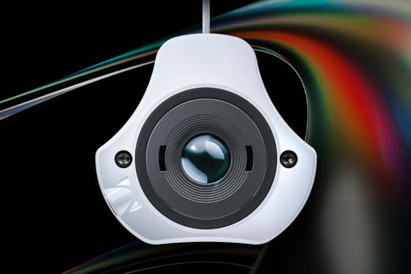 A white Datacolor Spyder calibration device against a multicoloured background