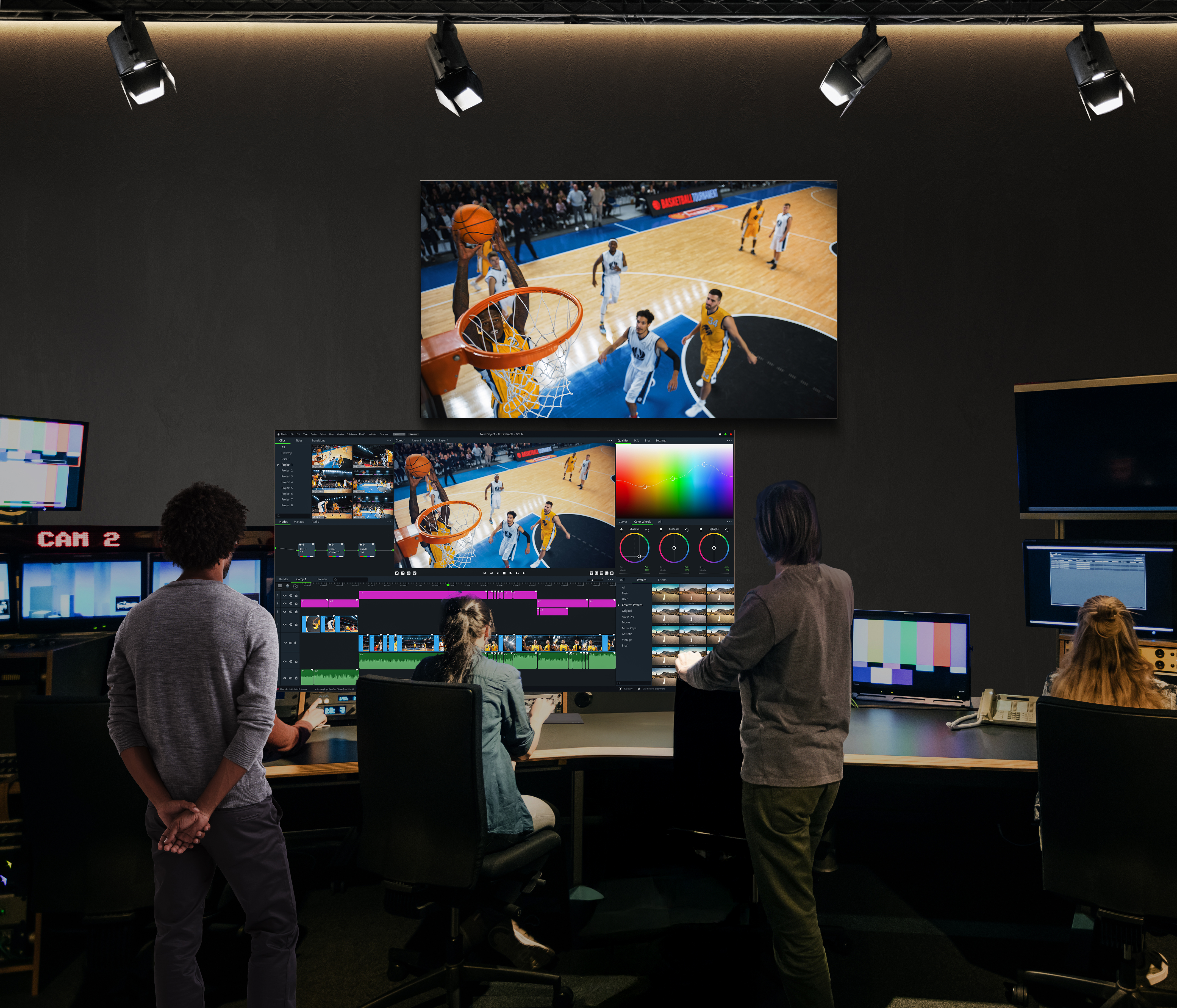 LG OLED Pro display showing basketball footage above an editing workstation in a production studio