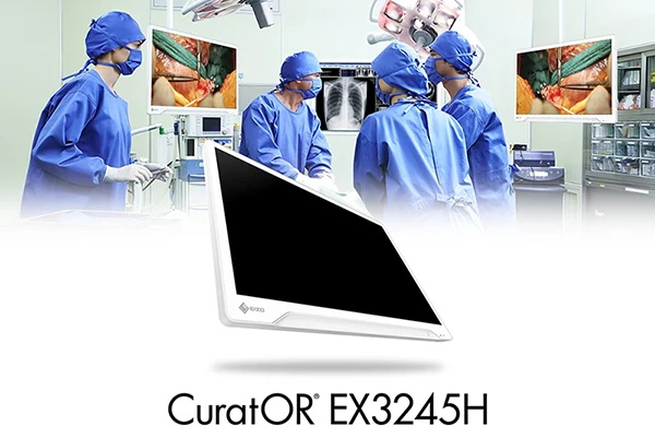 EIZO CuratOR EX3245H press illustration with the monitor and an operating-room scene.