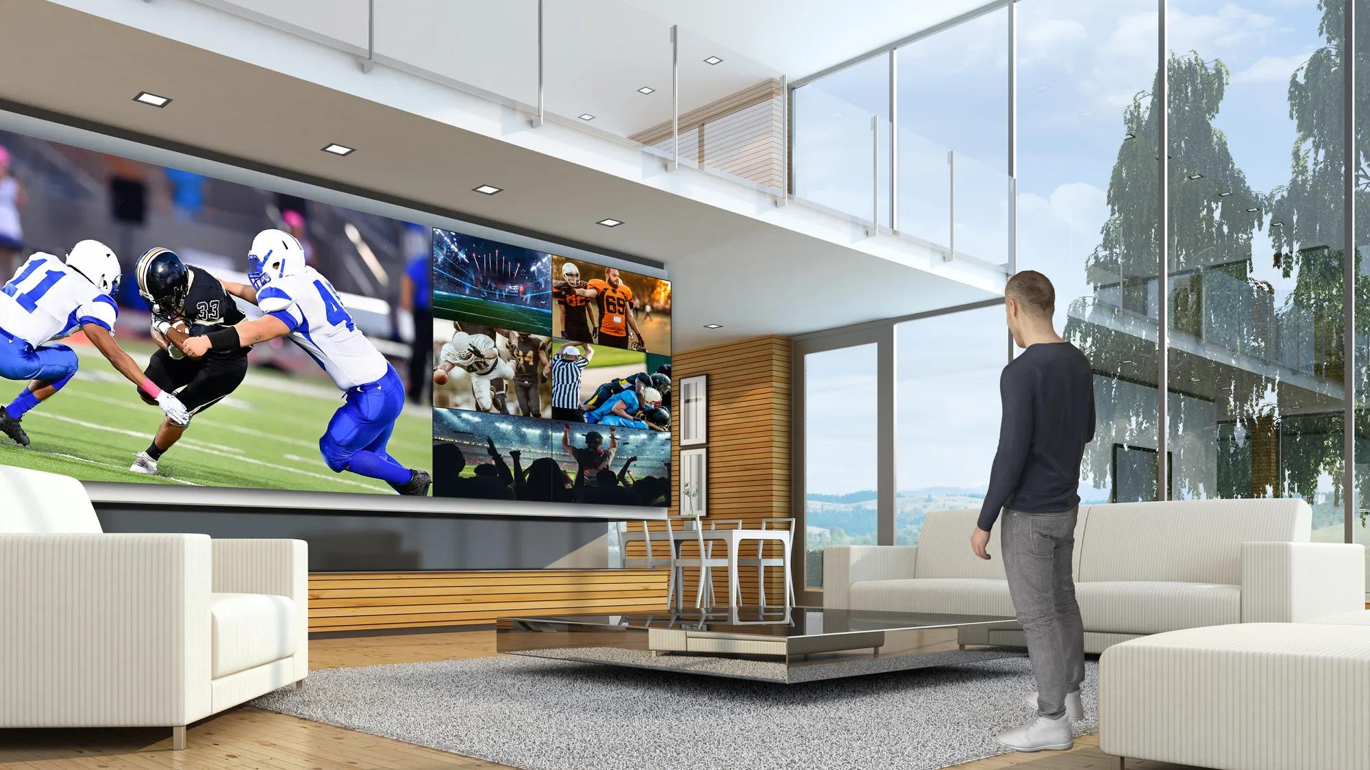 Large LG MAGNIT display showing sports in a bright living room