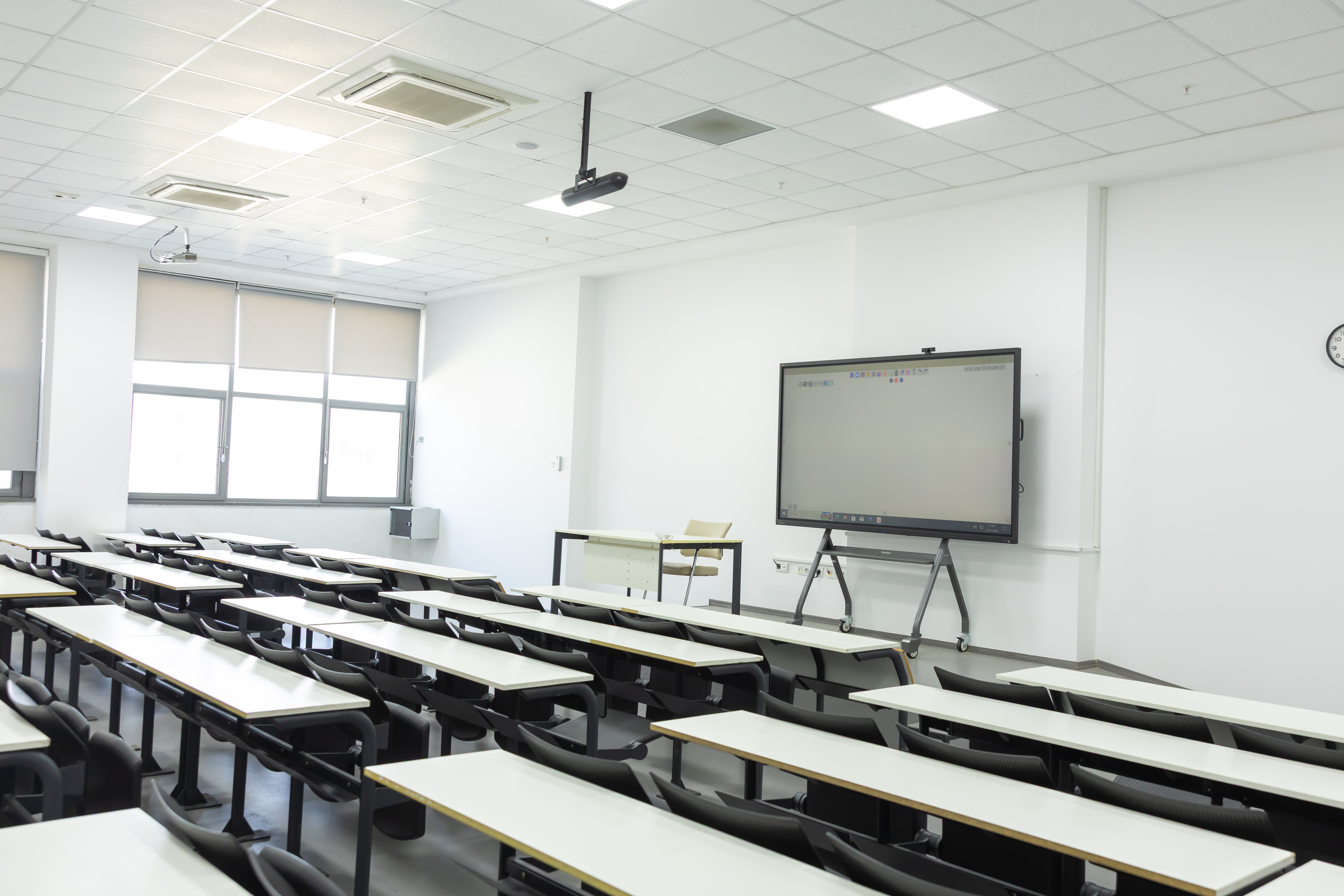 ViewSonic interactive display on a mobile stand at the front of a bright university classroom