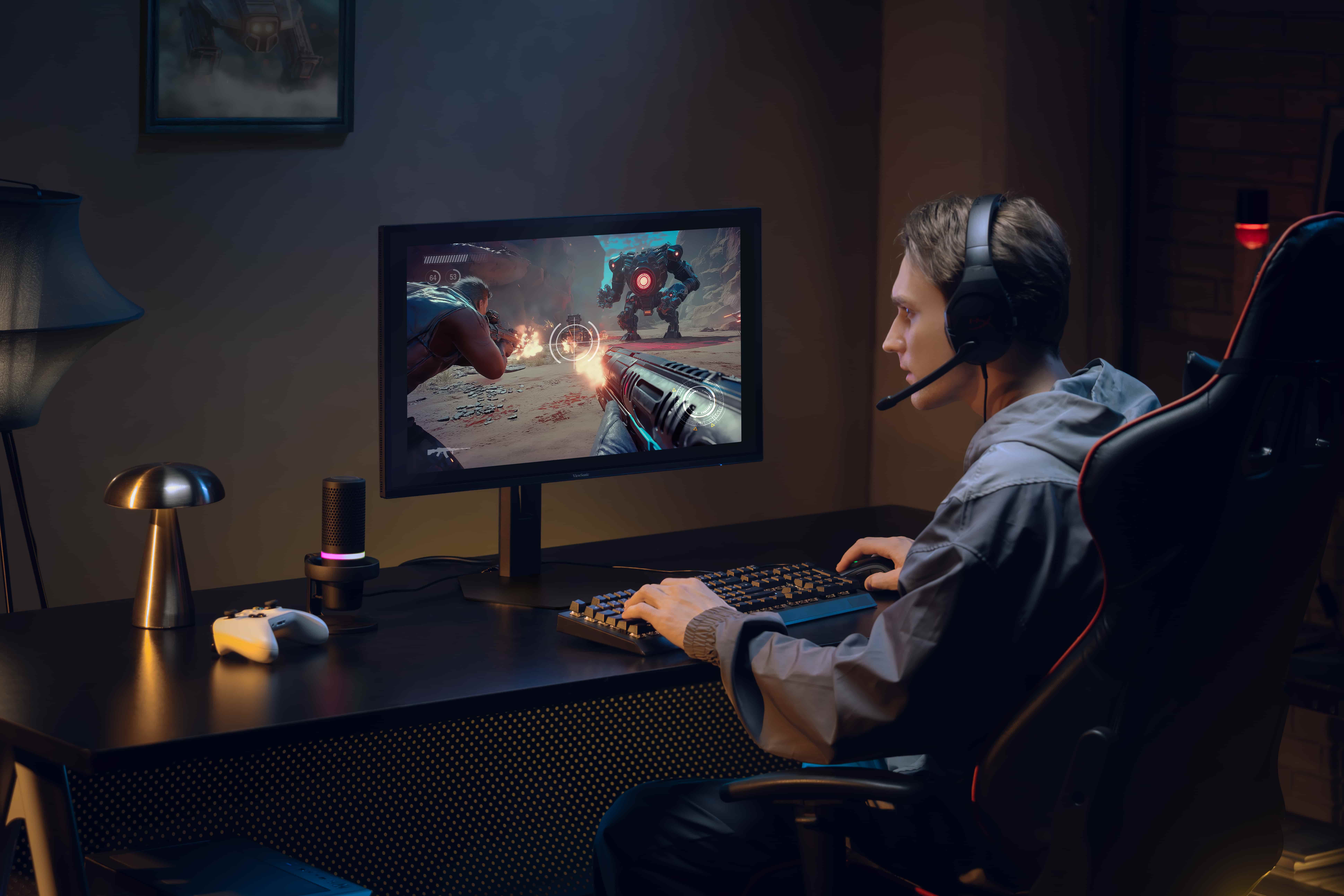 Gamer using a ViewSonic VX2738-2K-OLED monitor at a desk