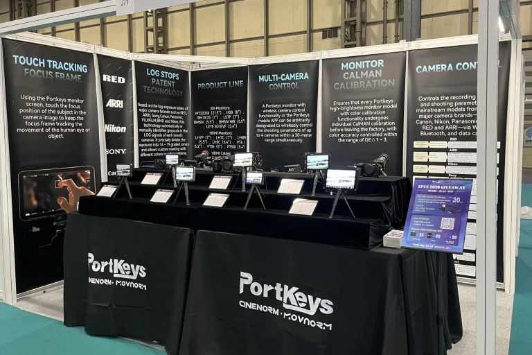 Portkeys’ TPVS 2026 exhibition stand showing camera monitors and the original explanatory banners.