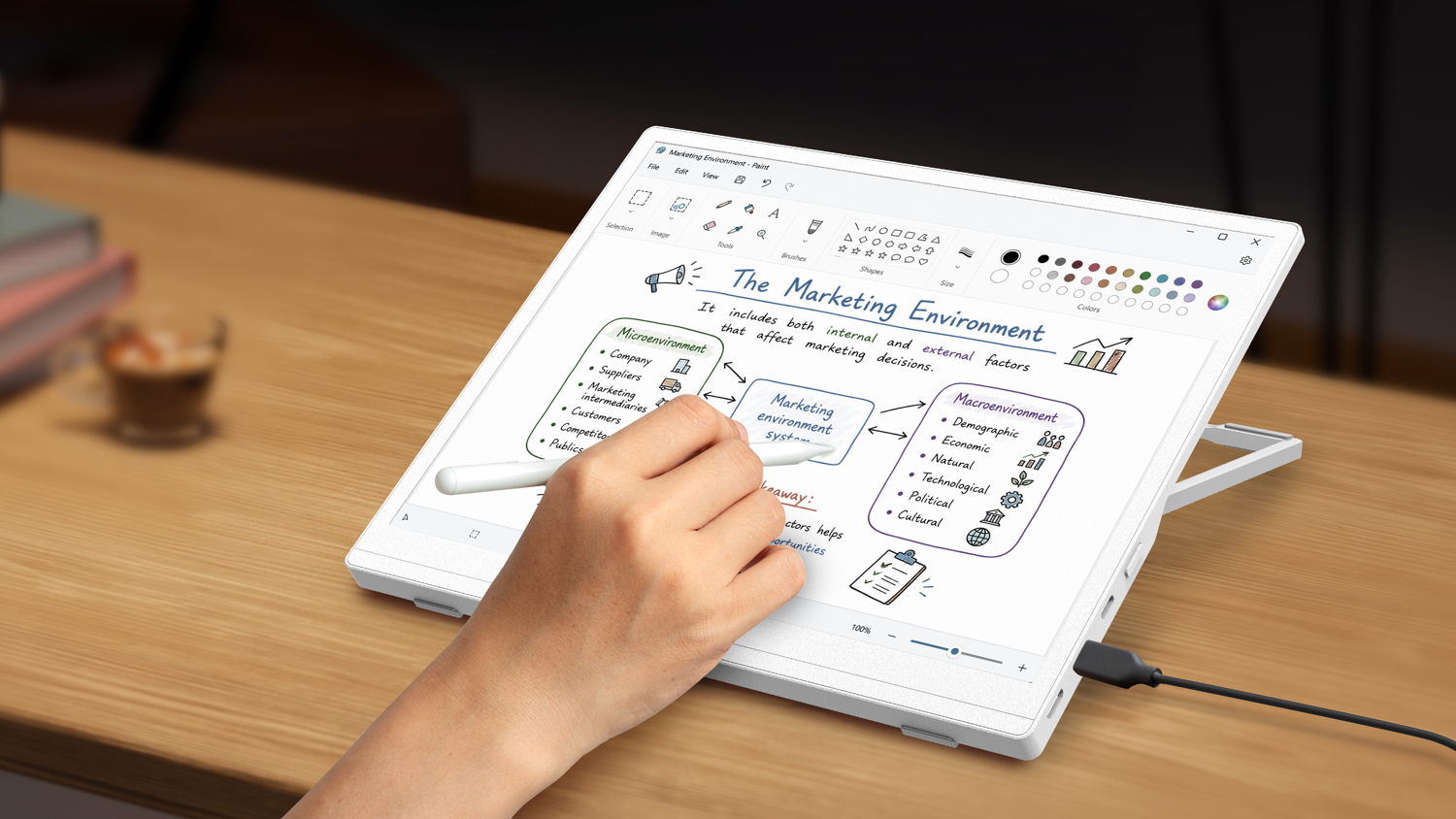 A person annotating a document with a stylus on the Acer EP130K ePaper monitor